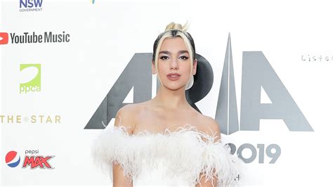 Long locks in a glossy cocoa shade. Dua Lipa Just Added Pink and Green Highlights to Her Hair ...