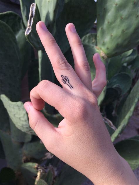 If you have ever wondered how to fuse your love for tattoos with your succulent tattoo cactus tattoo r tattoo leg tattoos tattoo drawings art drawings sacred heart. Small cute cactus finger tattoo | Small finger tattoos ...