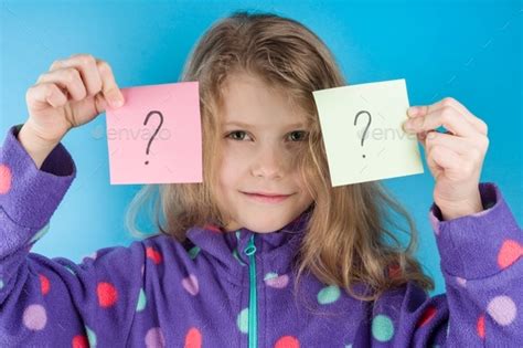 Child Girl Holding Stickers With Question Marks Stock Photo By