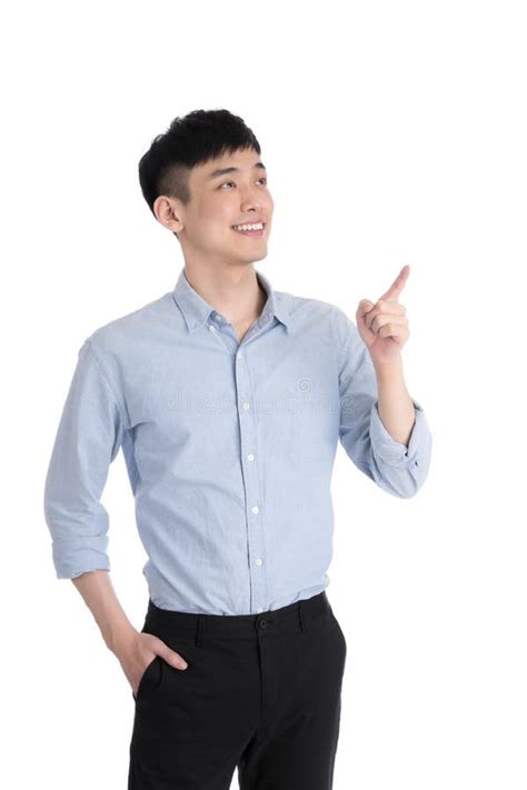 Handsome Young Asia Man Isolated Over A White Background Stock Photo