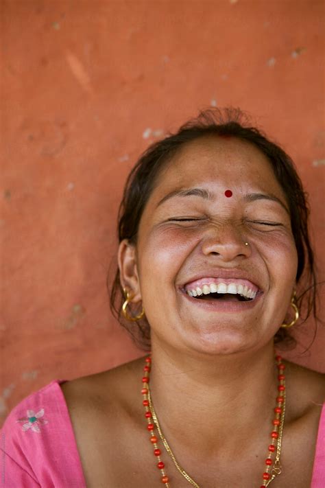 woman who cant control her laughter by stocksy contributor shikhar bhattarai stocksy