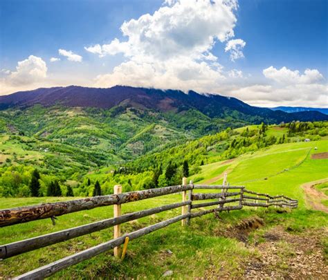 Fence On Hillside Meadow In Mountain At Sunrise Stock Image Image Of