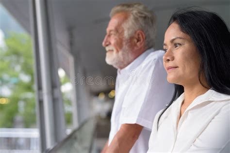 mature multi ethnic couple happy and in love while exploring the stock image image of