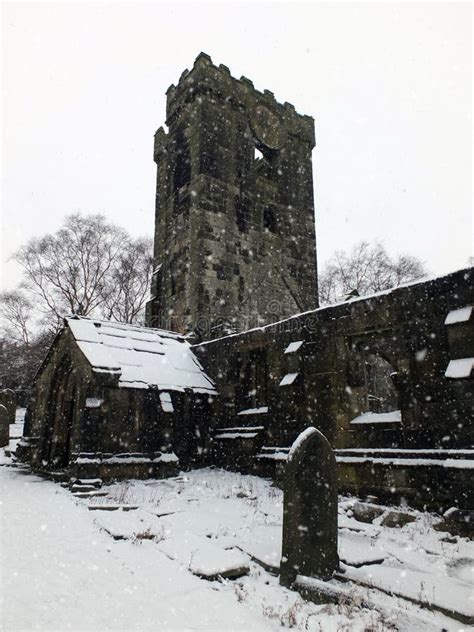 The Snow On Ruined Medieval Church In Heptonstall With Graveyard Stock