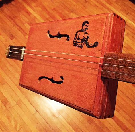 Just check out some turn over and slide the washers over the tuners and tighten the bushings. DIY Cigar Box Guitar | The Art of Manliness