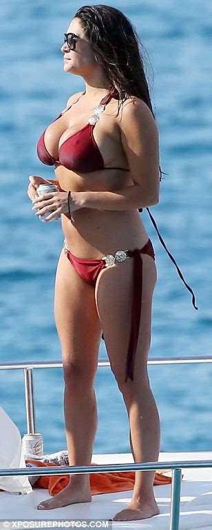 casey batchelor displays her eye popping cleavage in a tiny red bikini in ibiza daily mail online