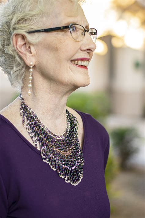 reasons to wear a statement necklace for a mature woman