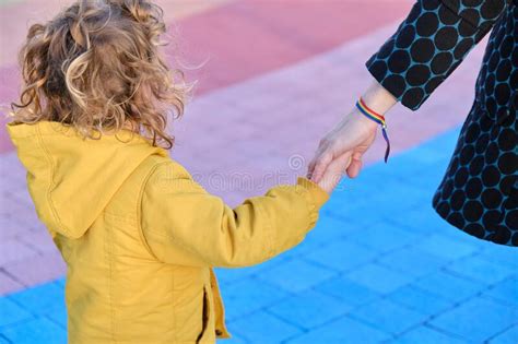Child Holding His Motherand X27s Hand In The Park Stock Photo Image