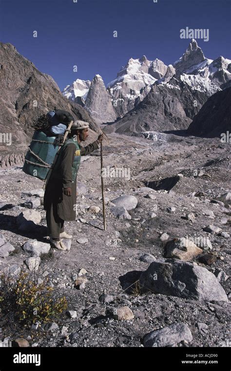 Porter Carrying Load On Moraine Karakorum Pakistan Stock Photo Alamy