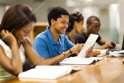 Happy Male African American College Student Using Tablet Computer Stock