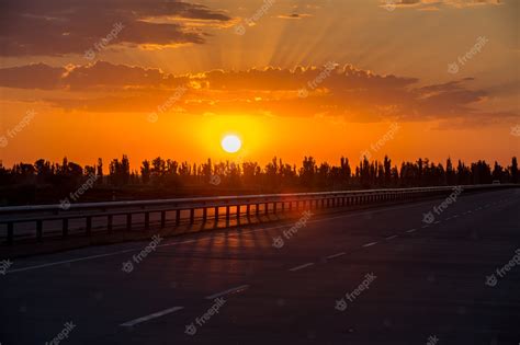 Premium Photo Picturesque Landscape Scene And Sunrise Above Road