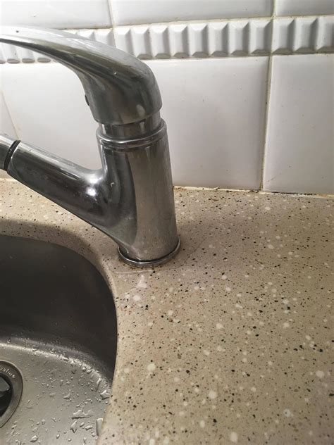Kitchen faucet leaking water into cabinet. How to approach fixing this kitchen sink faucet leak at ...