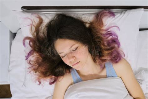 Teen Girl Sleeping At Home In Bed View From Above Stock Photo Image