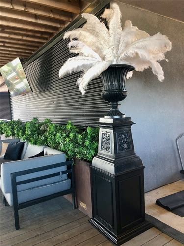 We would like to show you a description here but the site won't allow us. Tall Black Urn with Feathers