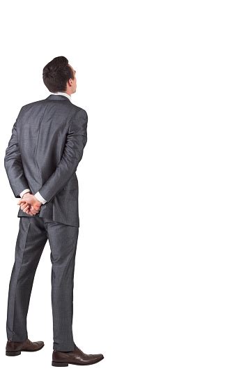 Businessman Standing With Hands Behind Back Stock Photo Download