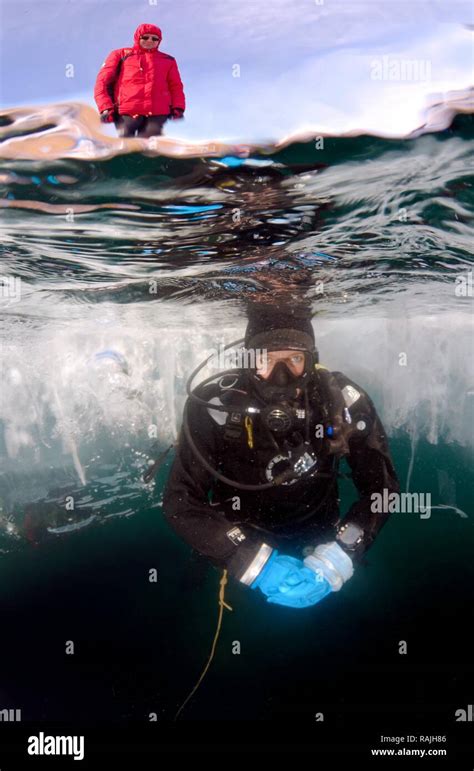 Diver Ice Diving In Lake Baikal Olkhon Island Siberia Russia Stock