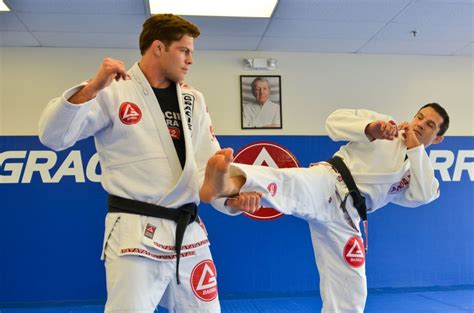 Two Bjj Fighters Grapple On The Mat At Gracie Barra In Phoenix Az