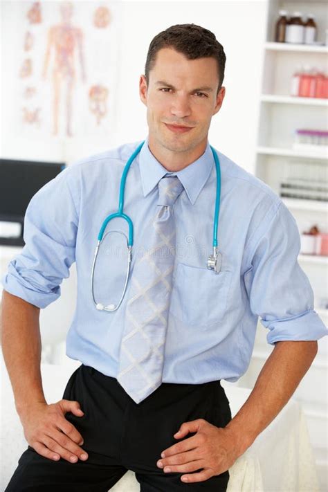 Young Male Doctor In Consulting Room Stock Image Image Of Trustworthy