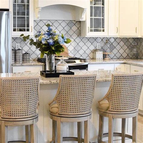 It includes one kitchen island and two stools, all made from engineered wood in a neutral finish. Makena Swivel Stool in 2020 | White kitchen bar stools ...