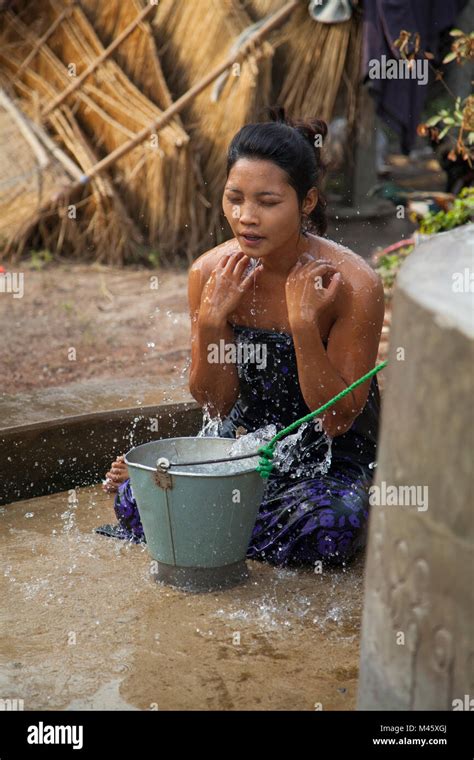 Woman Bathing In Small Town Well Outside Bagan Myanmar