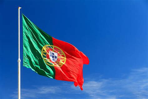 The portuguese flag unfurled in the wind. Bandeira De Portugal - Stock Photos e Imagens - iStock