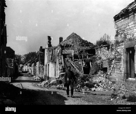 German Soldier In Front Of The Ruins Of A French Village 1915 Stock