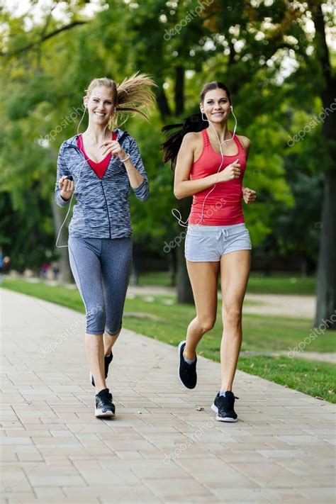Two Women Jogging In Park — Stock Photo © Nd3000 166658658