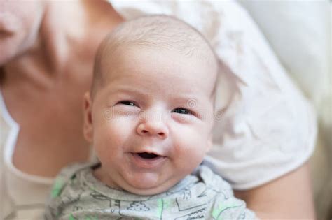 Close Up Detail Portrait Of Cute Little Peaceful Smiling Baby Boy Face