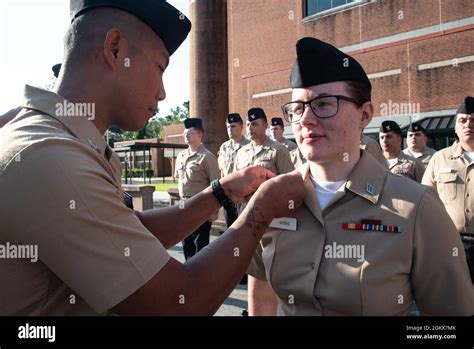 A Sailor Serving Aboard Naval Hospital Cherry Point Pins The Rank Of
