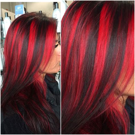 Black hair with neon pink highlights. Chunky red highlights by @hairbyangelaalberici Long Island ...