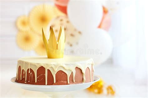 Yummy Birthday Cake With Golden Crown On Baby Party Background Stock