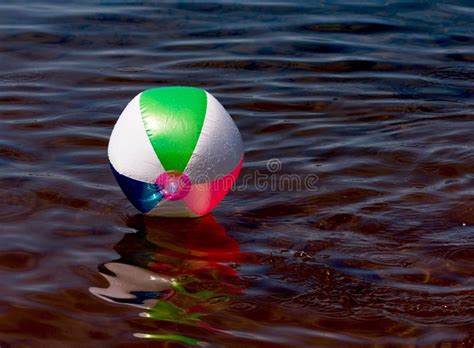 Beach Ball Floating On A Lake Stock Photo Image Of Summer Floating