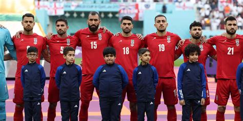 iran threatened families of its world cup team after players refused to sing the national anthem