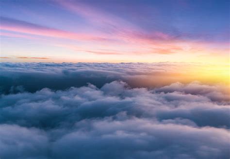 Beautiful Sunset Sky Above Clouds With Nice Dramatic Light Stock Photo
