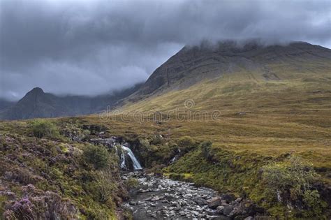 A Waterfalls In Scotland With Heavy Clouds Stock Photo Image Of
