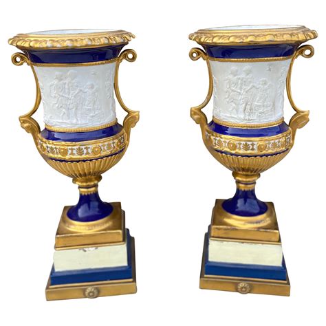 Pair Of 19th Century French Porcelain Urns With Neoclassical Scenes For