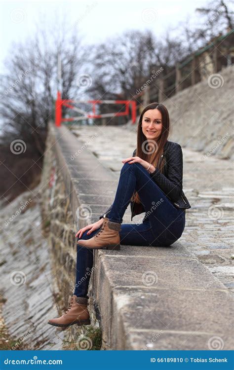 Brunette Girl Wearing Leather Jacket Blue Jeans And Boots Stock Photo