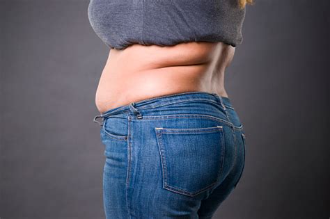 Woman With Fat Abdomen In Blue Jeans Overweight Female Stomach Stretch