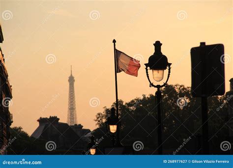 Sunset In Paris With A View Of The Eiffel Tower Yellow Light Pole And