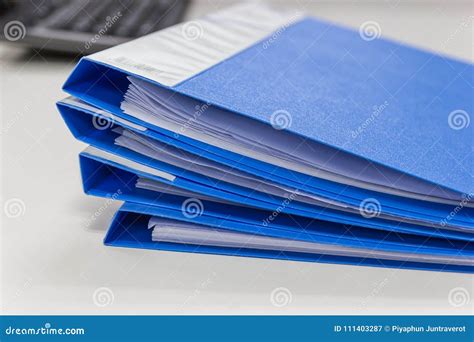 Blue File Folder With Documents On Table In Work Office Stock Image