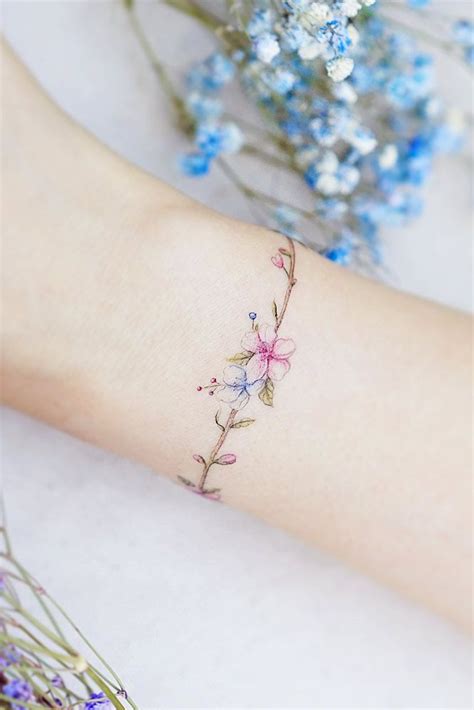 Delicate Wrist Tattoos For Your Upcoming Ink Session Flower Wrist