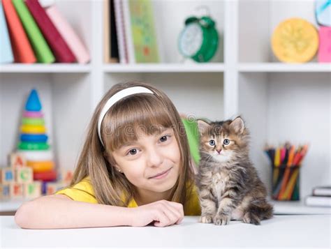 Little Girl With Kitten At Home Stock Image Image Of Girl Adorable