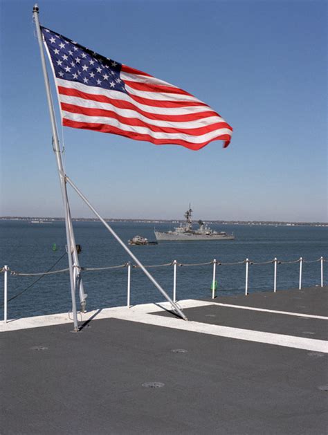 The American Flag Flies From The Stern Of The Nuclear Powered Aircraft