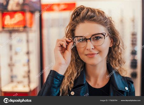 Young Attractive Woman Trying Glasses — Stock Photo © Bnenin 175608764