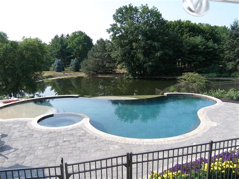 Freeform Gunite Pool With Spill Over Spa Beach Entry And Negative