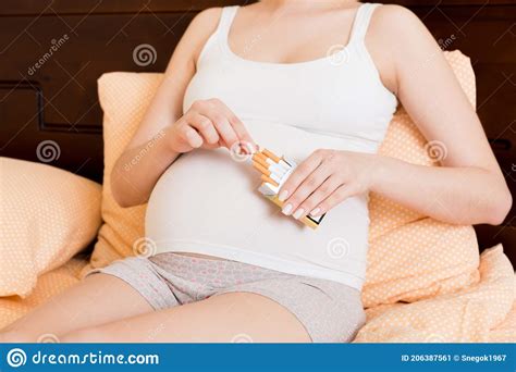 Pregnant Woman Smoking Cigarette At Home In Bed Stock Image Image Of