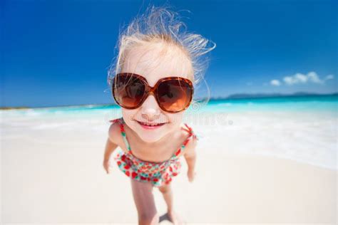 Adorable Happy Smiling Little Girl On Beach Vacation Stock Image