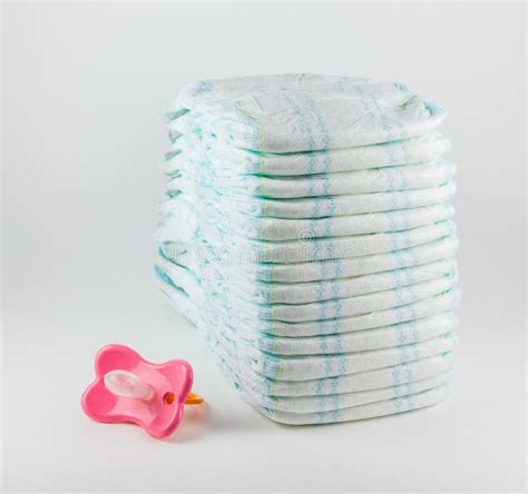 Stack Of Nappies And Pacifier Stock Image Image Of Diapers
