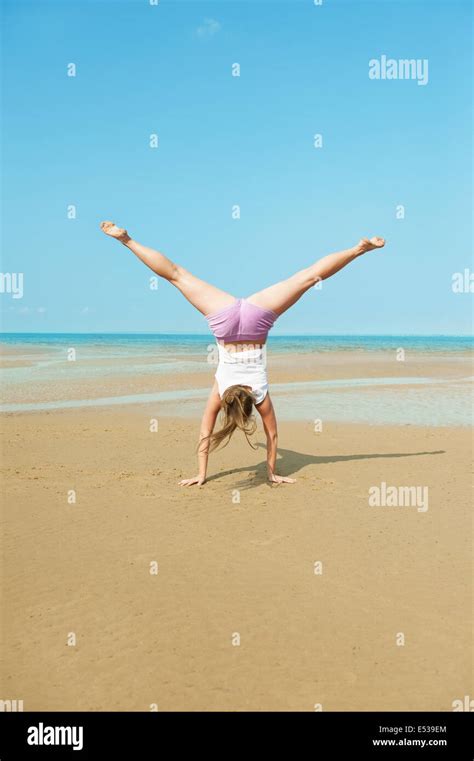 Young Girl Doing Handstand On The Beach Hi Res Stock Photography And