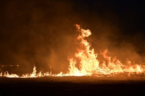 Premium Photo Fire On The Field At Night